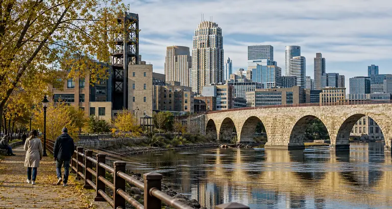 Photoreal Minneapolis riverfront skyline near Stone Arch Bridge