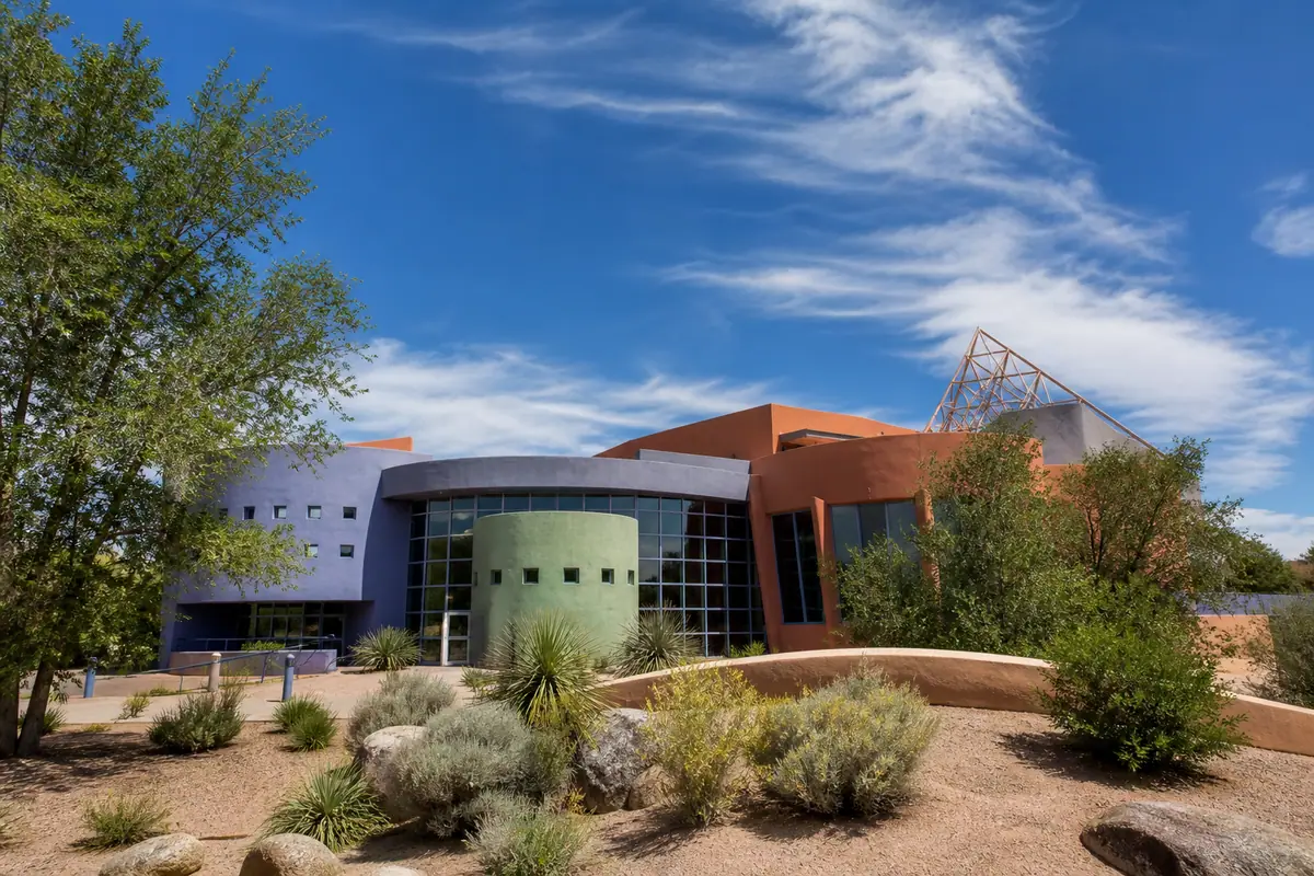 Photoreal travel-editorial view of Explora Science Center in Albuquerque, New Mexico