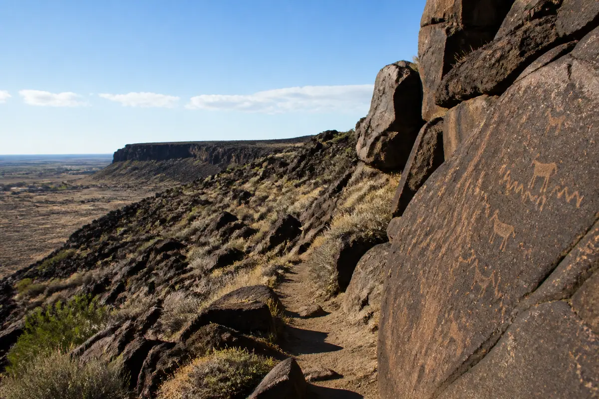 Photoreal travel-editorial view of Petroglyph National Monument in Albuquerque, New Mexico