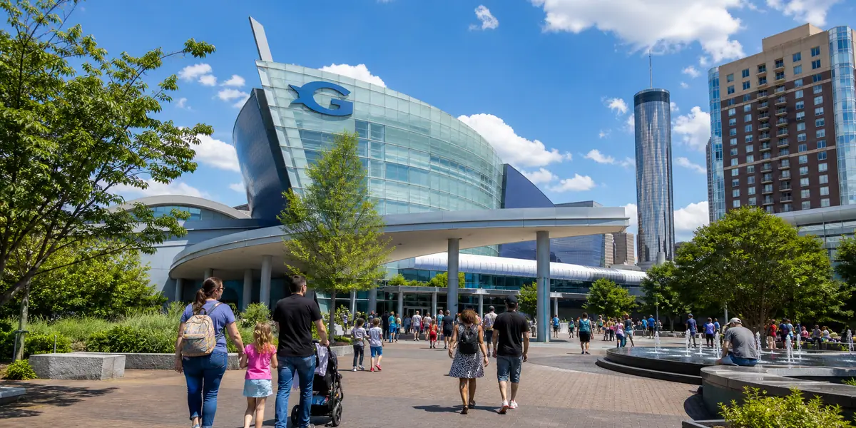 Photoreal visitor plaza and aquarium exterior scene representing Georgia Aquarium Area in Atlanta