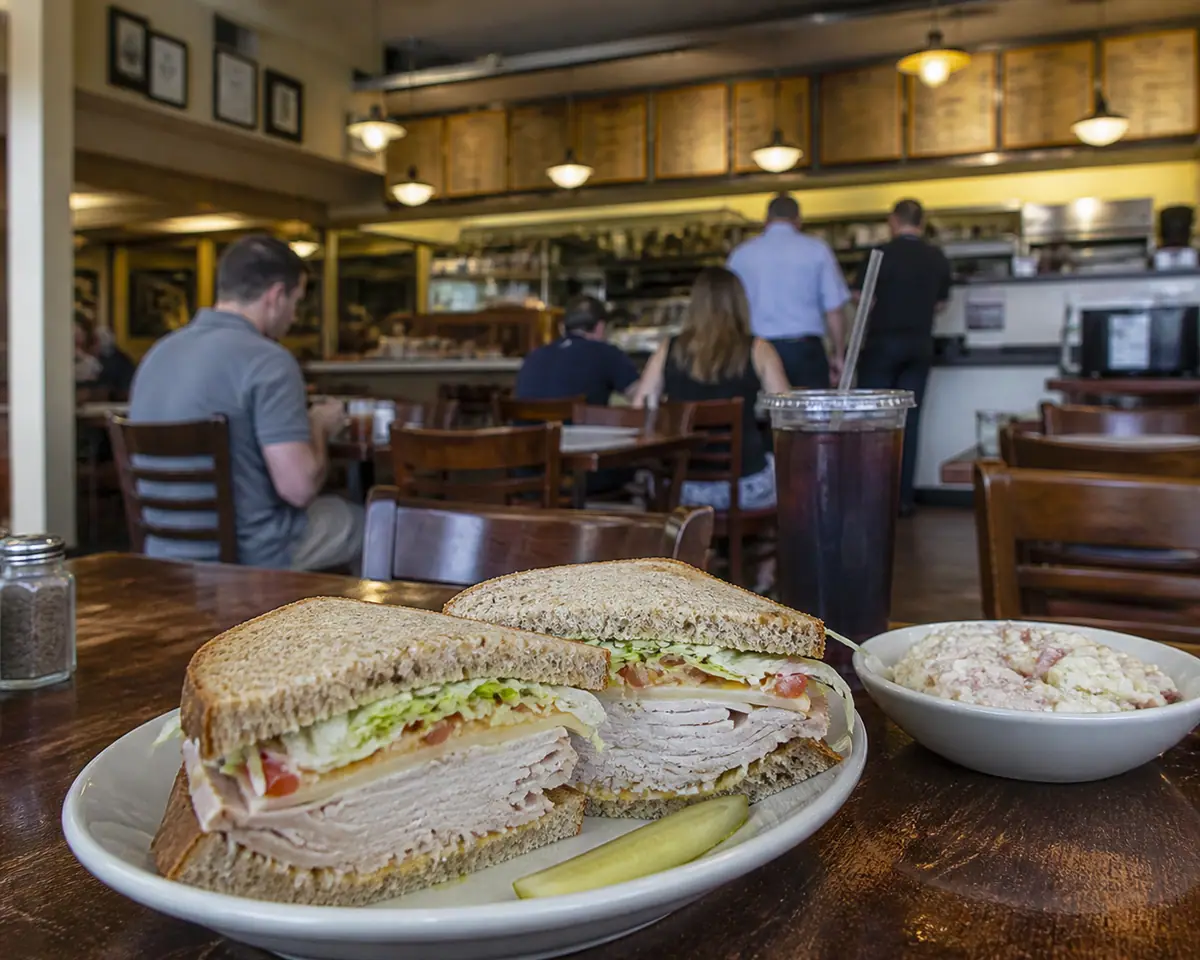 Photorealistic travel-editorial view of Brown Bag Deli in Columbus, Ohio