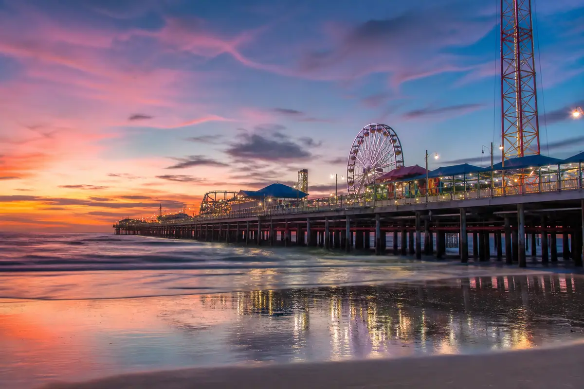 Photoreal travel-editorial view of Daytona Beach Boardwalk and Pier in Daytona Beach, Florida