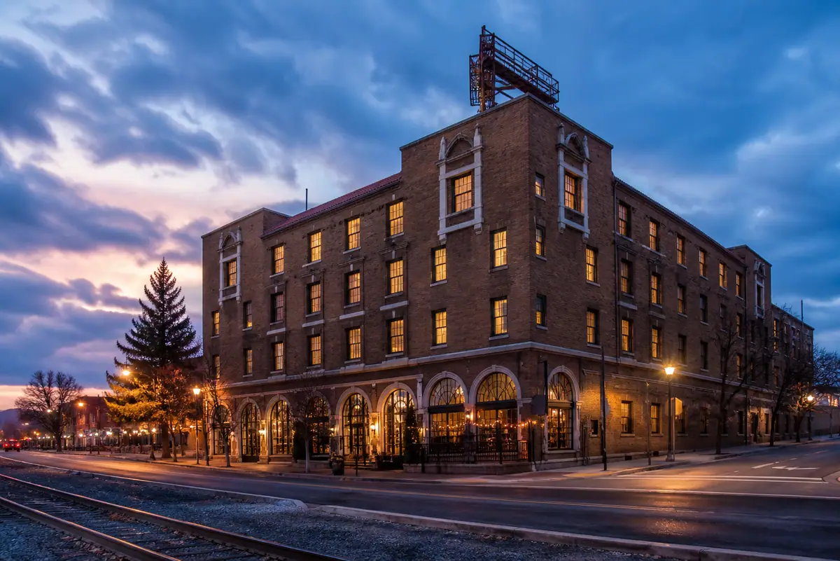 Photoreal travel-editorial exterior of Hotel Monte Vista in Flagstaff, Arizona