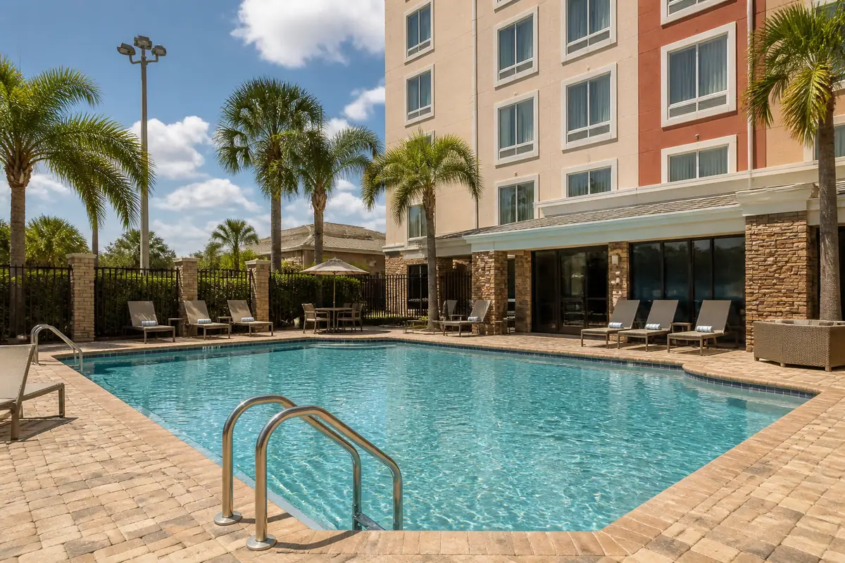Photoreal travel-editorial view of Homewood Suites by Hilton Fort Myers Airport/FGCU in Fort Myers, Florida