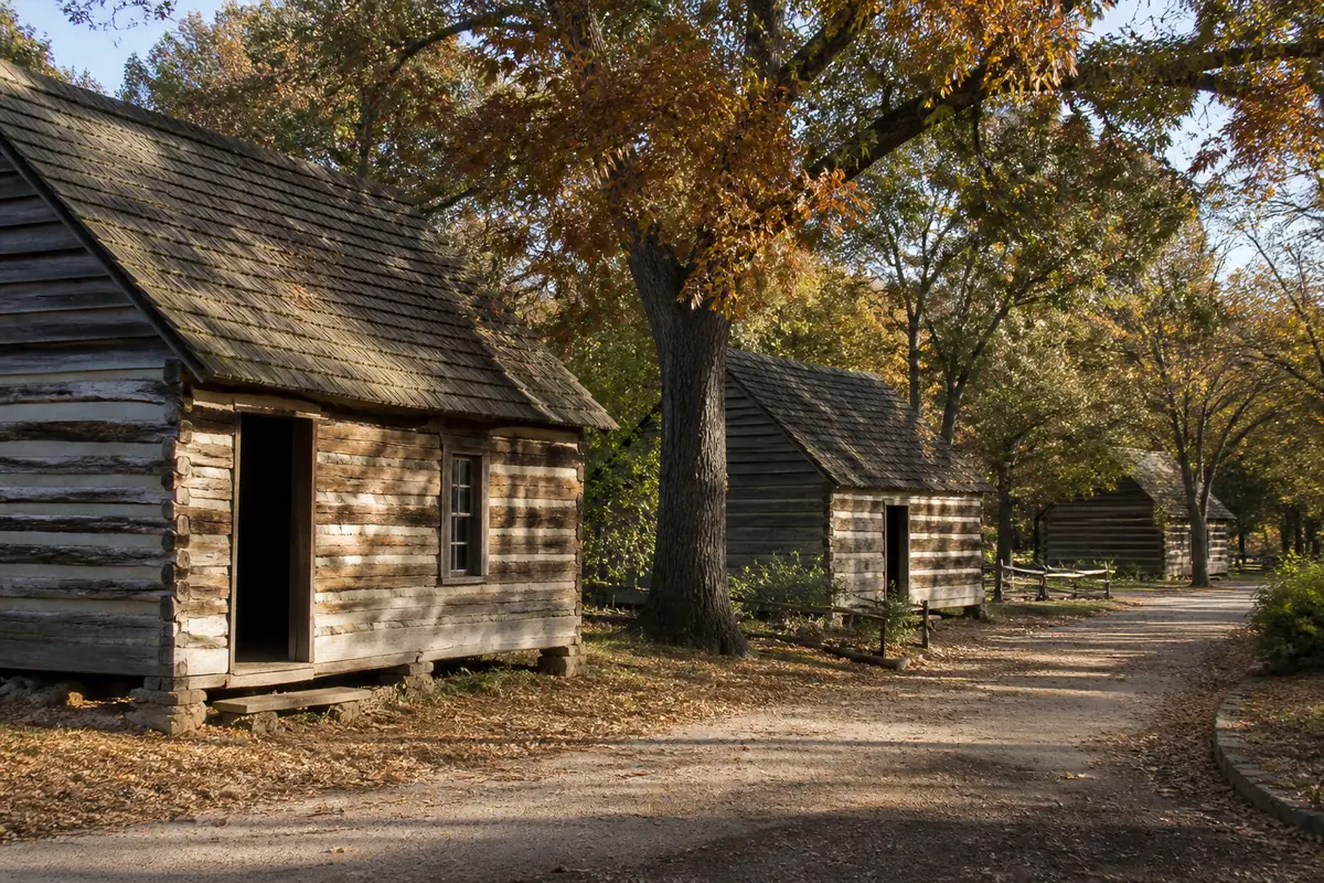 Photoreal editorial view of Log Cabin Village in Fort Worth, Texas