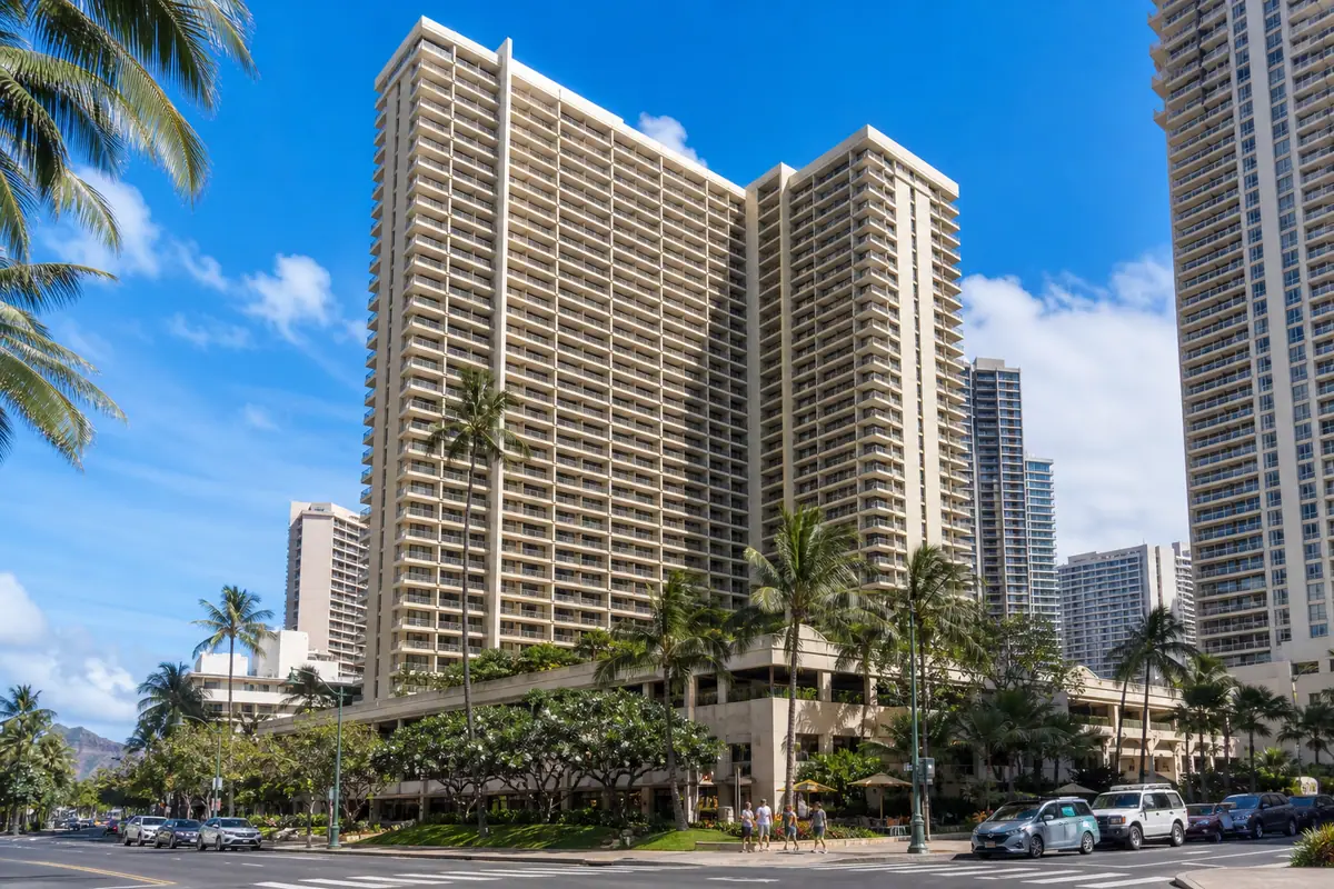 Photoreal exterior of Waikiki Banyan with balconies and palms