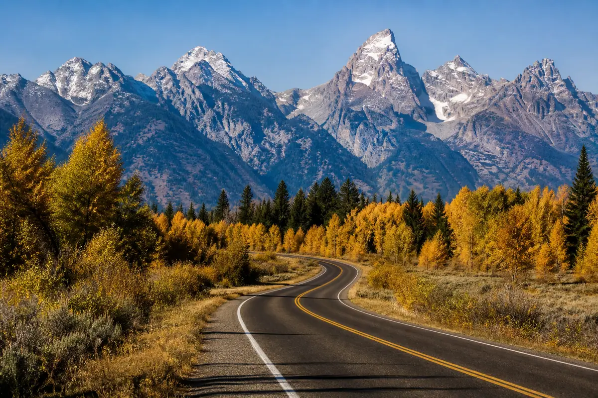 Photorealistic travel-editorial view of Grand Teton National Park Scenic Loop in Jackson, Wyoming