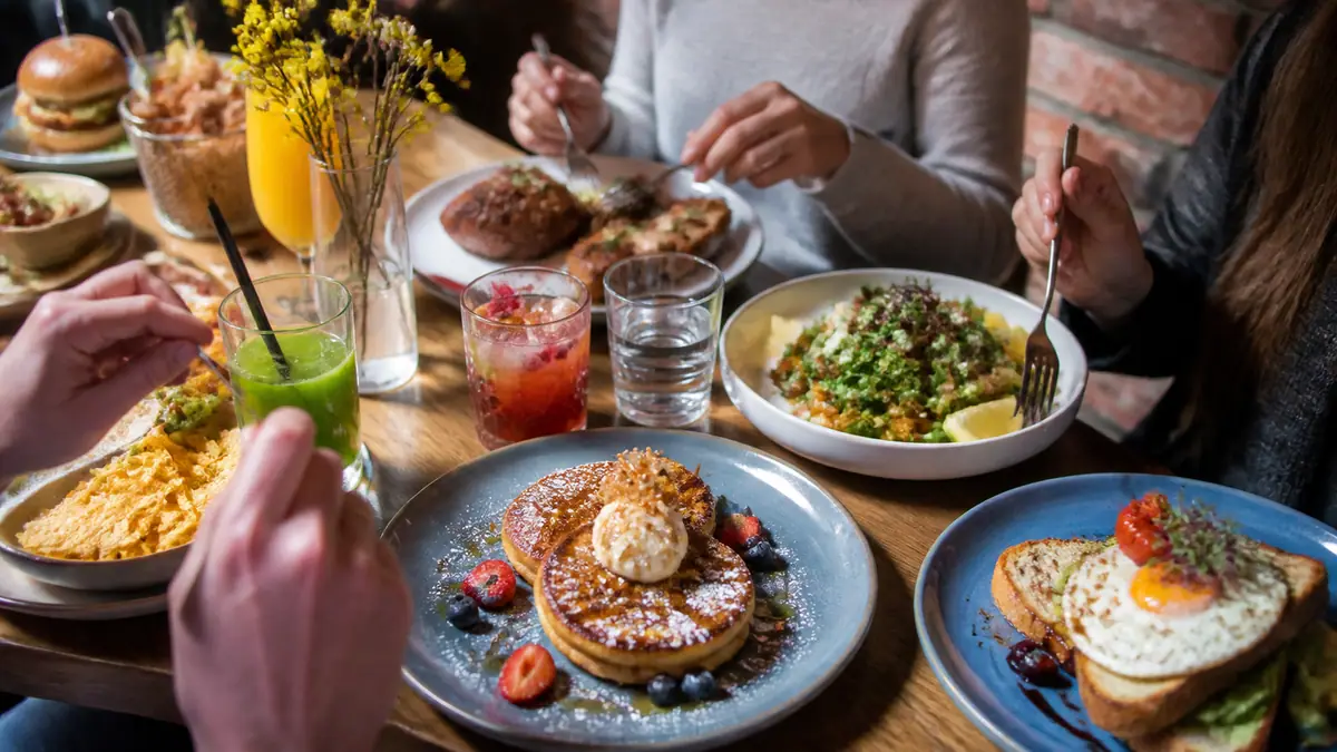 Photoreal travel-editorial view of Bassett Street Brunch Club in Madison, Wisconsin