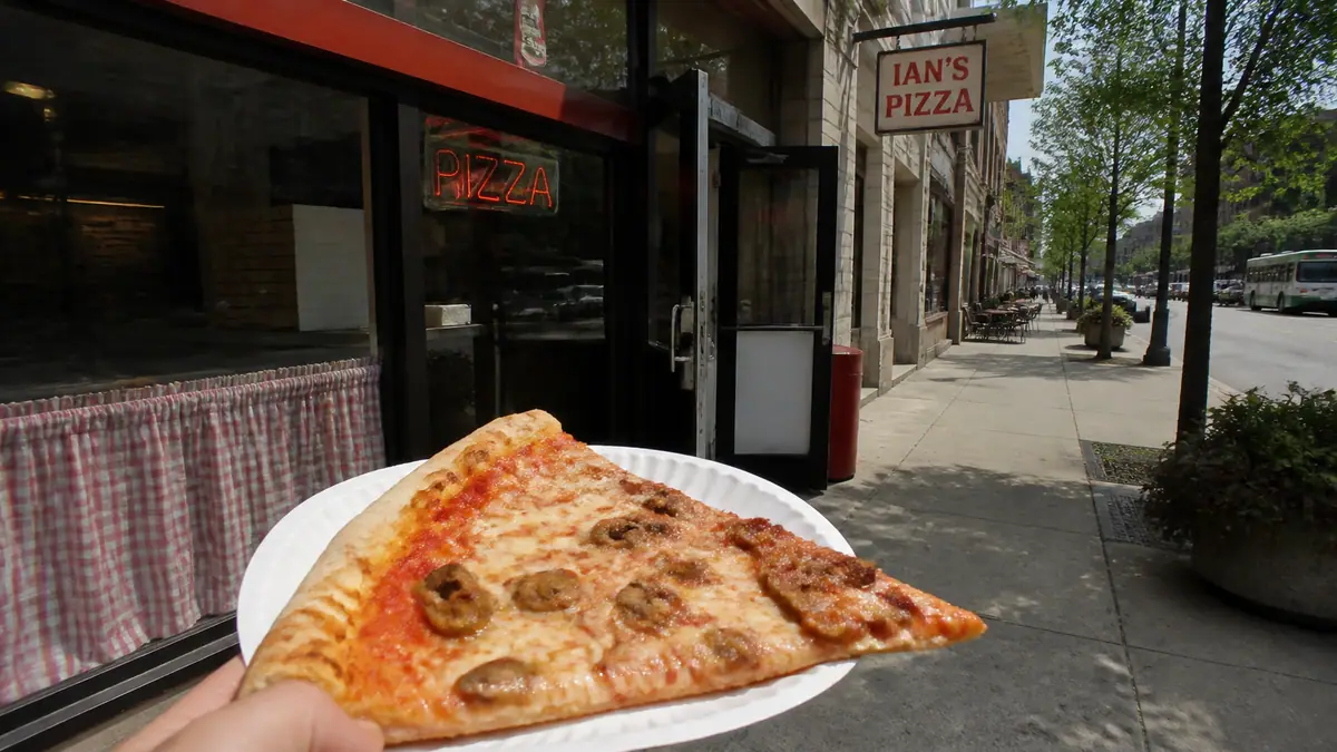 Photoreal travel-editorial view of Ian's Pizza in Madison, Wisconsin