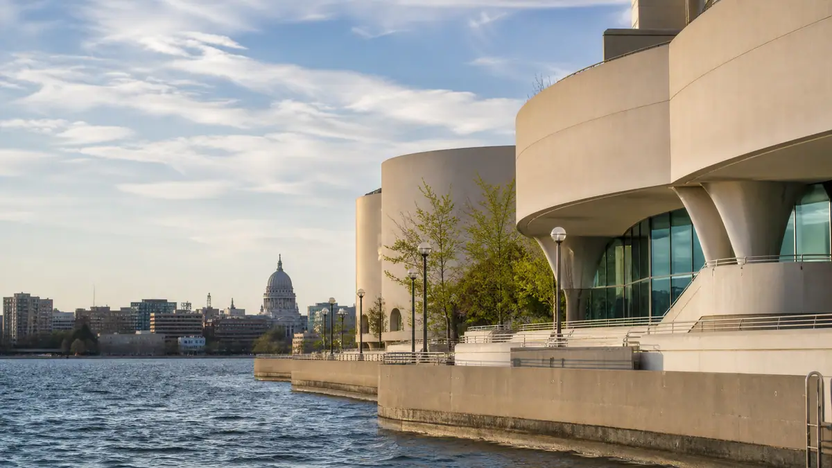 Photoreal travel-editorial view of Monona Terrace Community and Convention Center in Madison, Wisconsin