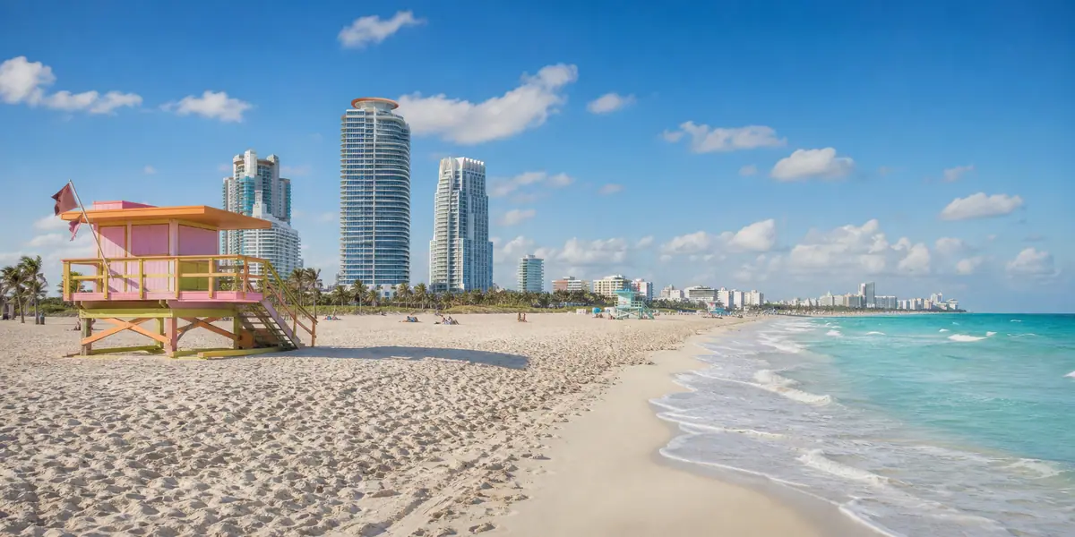 Photoreal South Beach shoreline and pastel Miami Beach skyline in bright daylight