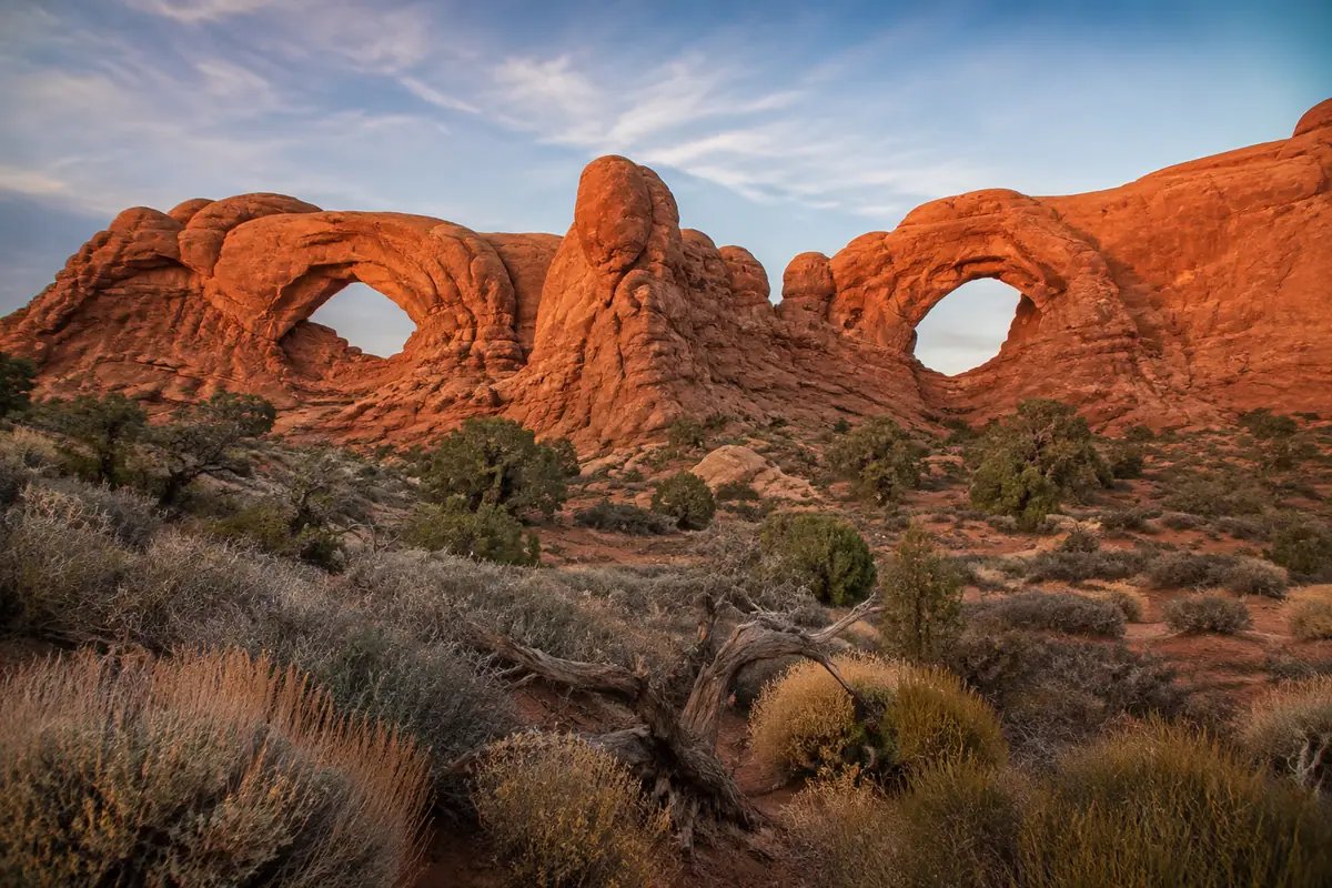 Photoreal travel-editorial view of Arches Scenic Drive and Windows Section in Moab, Utah