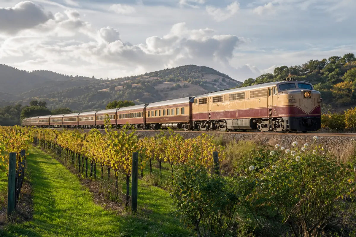 Photoreal travel-editorial view of Napa Valley Wine Train in Napa Valley, California
