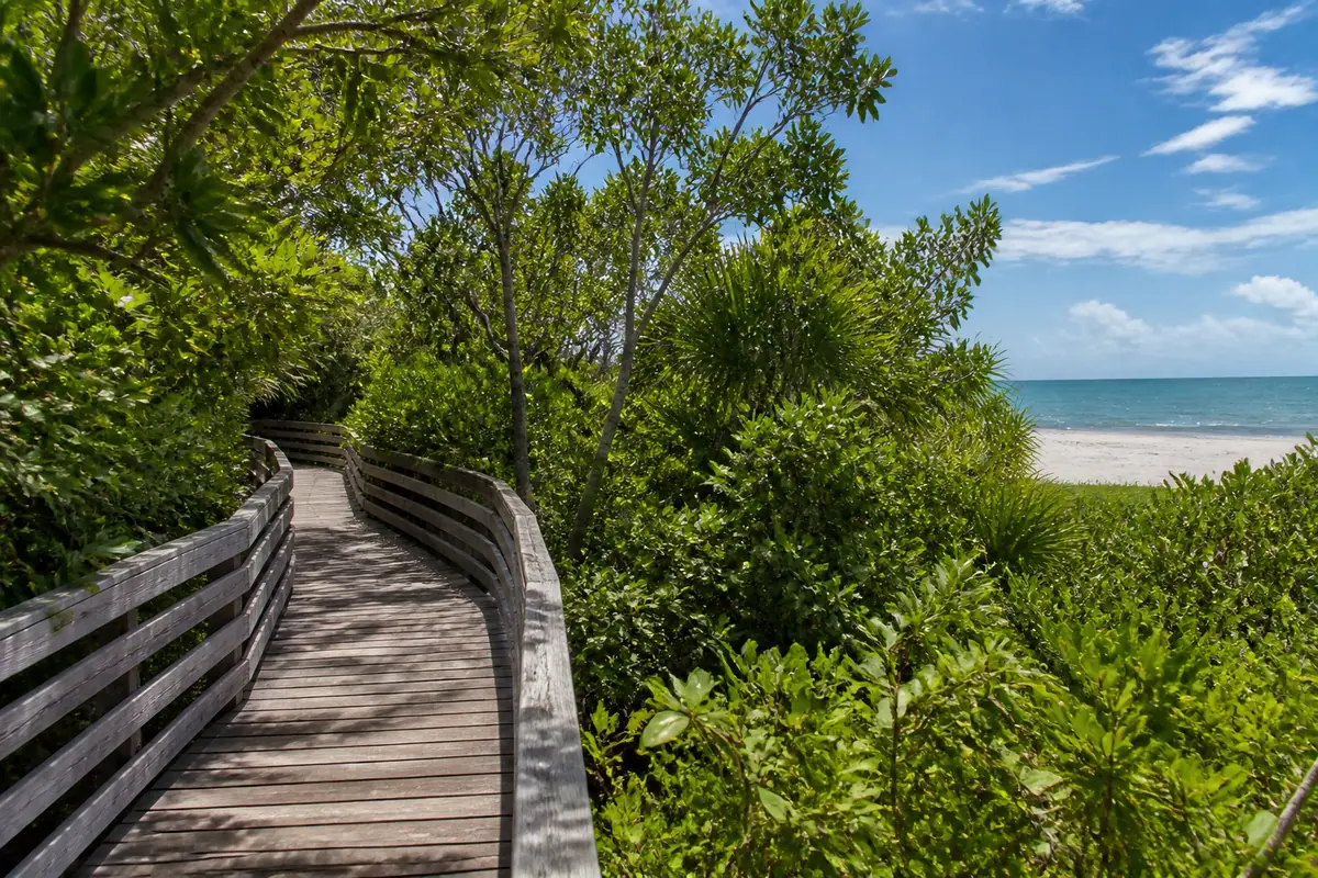 Photoreal travel-editorial view of Clam Pass Park in Naples, Florida