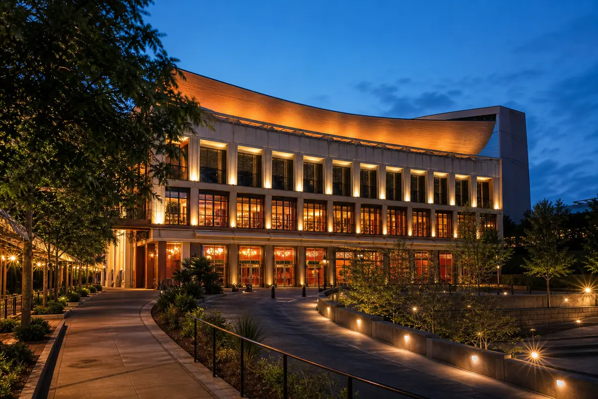 Photoreal grand Nashville music venue exterior glowing at blue hour