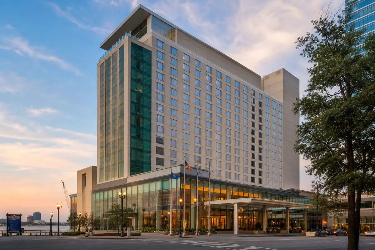 Photoreal harborfront hotel exterior representing Norfolk Waterside Marriott