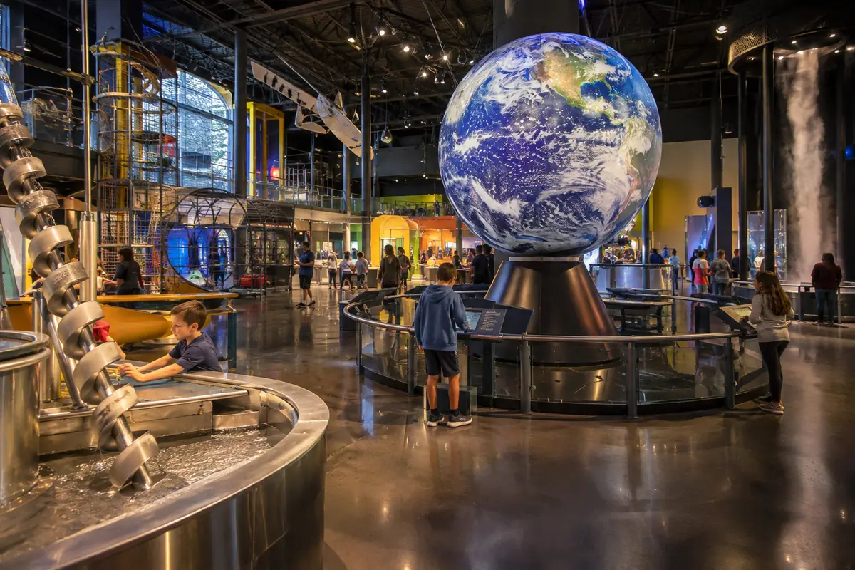 Photoreal travel-editorial view of Science Museum Oklahoma in Oklahoma City, Oklahoma