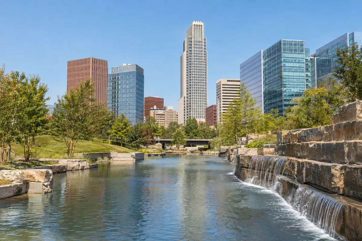 Photoreal travel-editorial view of Gene Leahy Mall in Omaha, Nebraska