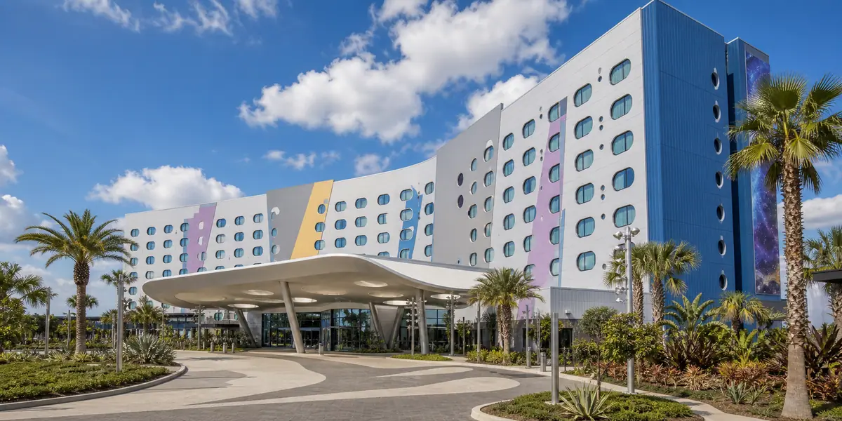 Photoreal sleek contemporary resort exterior representing Universal Stella Nova Resort