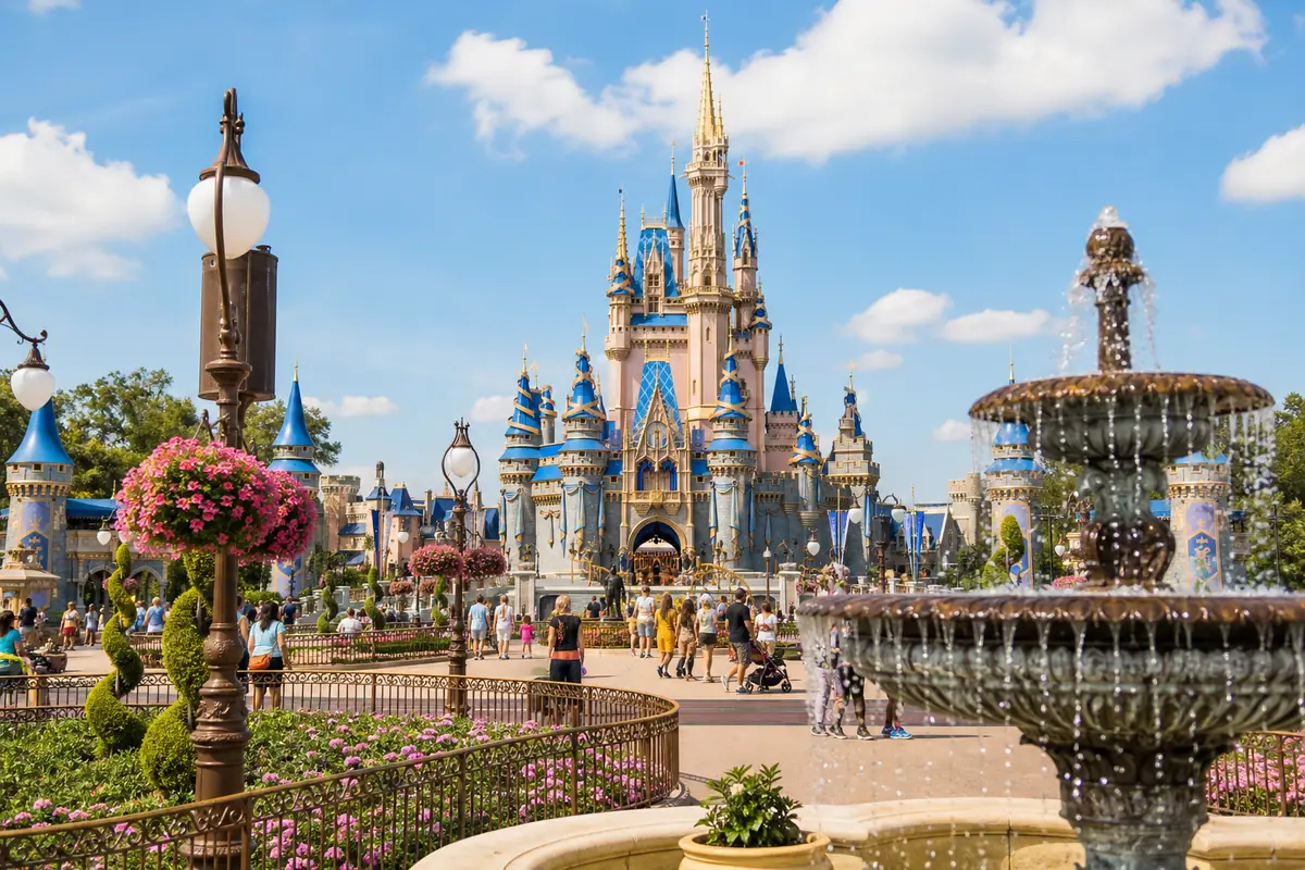Photoreal fantasy-theme park day scene with castle-style architecture and family atmosphere representing a Walt Disney World Park Day