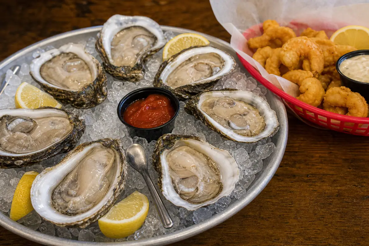 Photoreal oysters and fried seafood basket representing Hunt's Oyster Bar & Seafood Restaurant