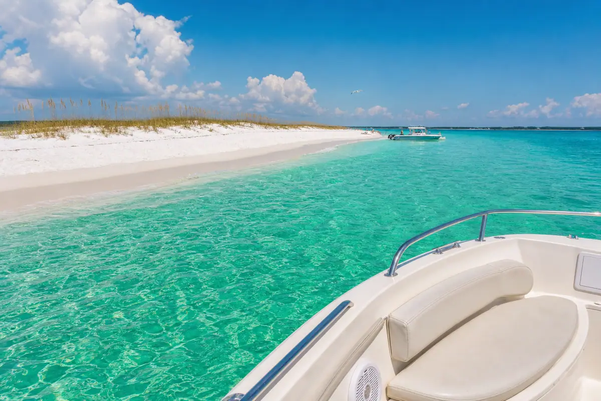 Photoreal boat excursion scene with turquoise water and undeveloped shoreline representing a Shell Island Boat Trip