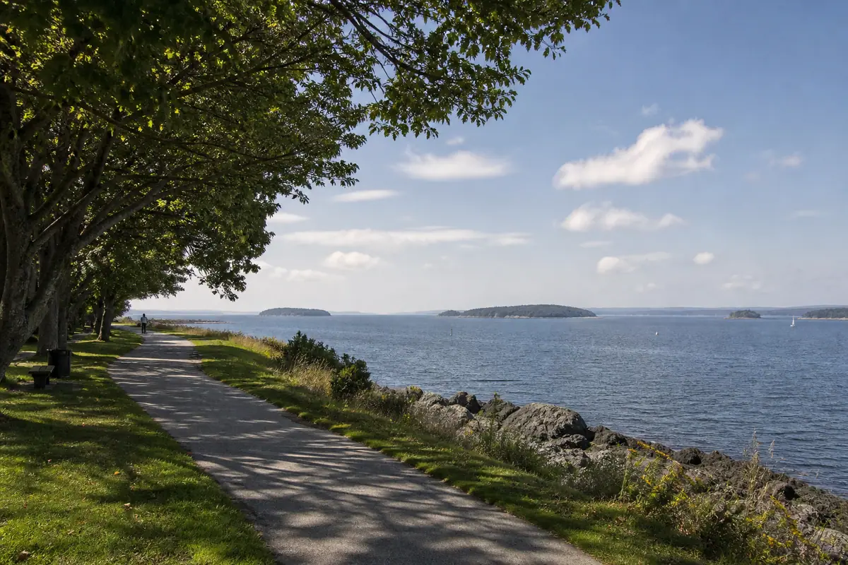 Photoreal travel-editorial view of Eastern Promenade Trail in Portland, Maine