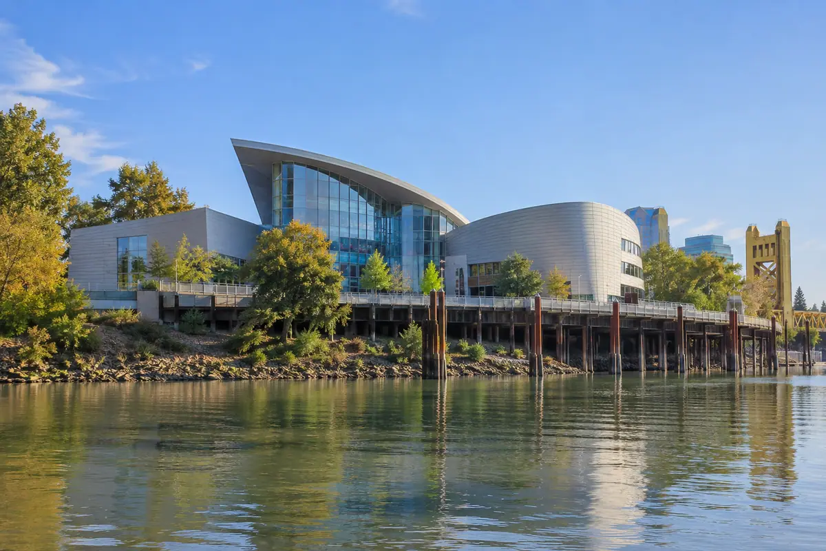 Photorealistic travel-editorial view of SMUD Museum of Science and Curiosity in Sacramento, California