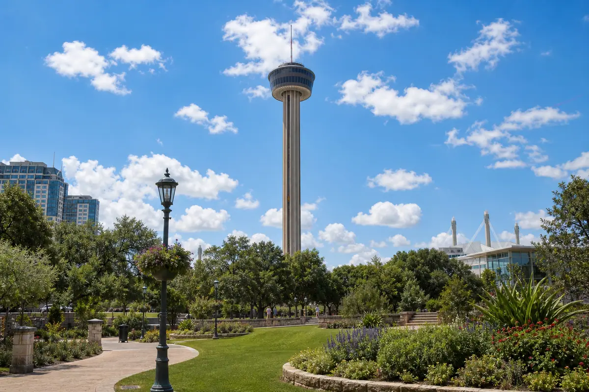 Photoreal Tower of the Americas rising above landscaped Hemisfair grounds in San Antonio under bright daylight