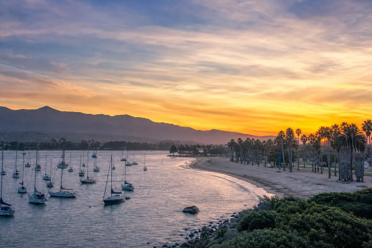 Photoreal travel-editorial view of Santa Barbara Harbor and West Beach in Santa Barbara, California
