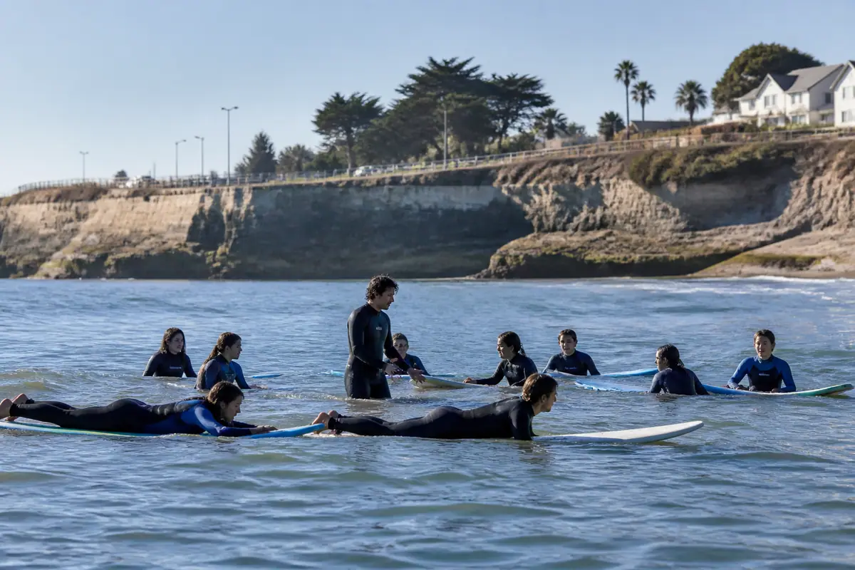 Photoreal travel-editorial view of Cowell Beach Surf Lesson in Santa Cruz, California
