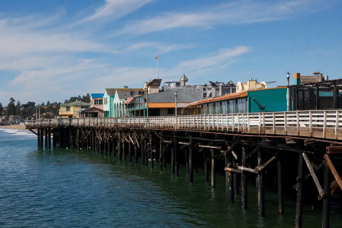Photoreal travel-editorial view of Santa Cruz Wharf in Santa Cruz, California