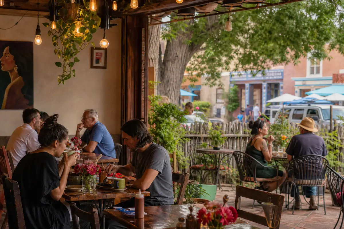 Photoreal dining scene representing Tune-Up Cafe in Santa Fe