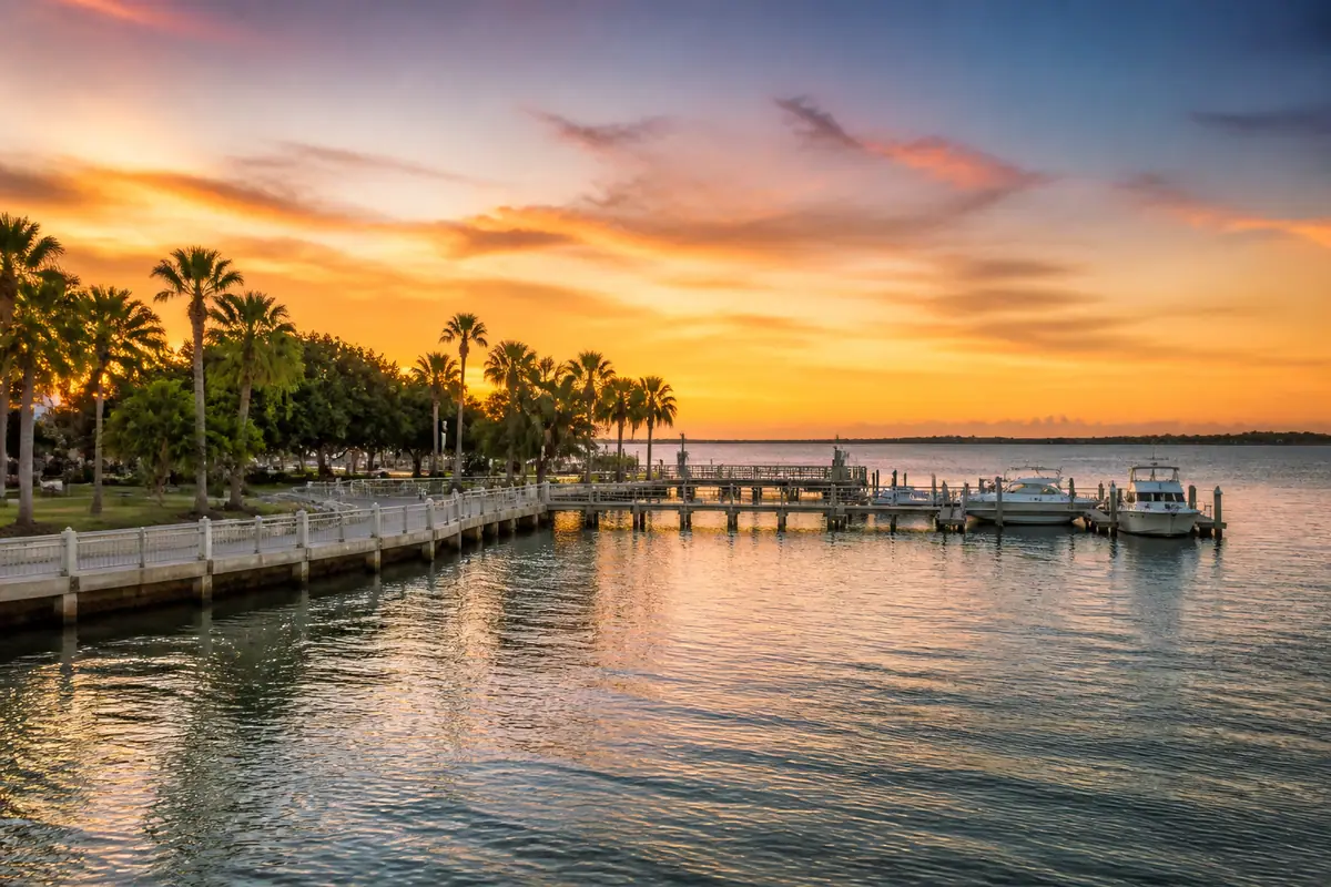 Photoreal travel-editorial view of Bayfront Park and Marina Jack in Sarasota, Florida