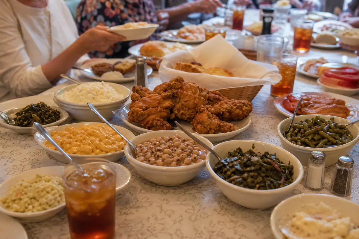 Photoreal dining or food scene representing Mrs. Wilkes Dining Room in Savannah