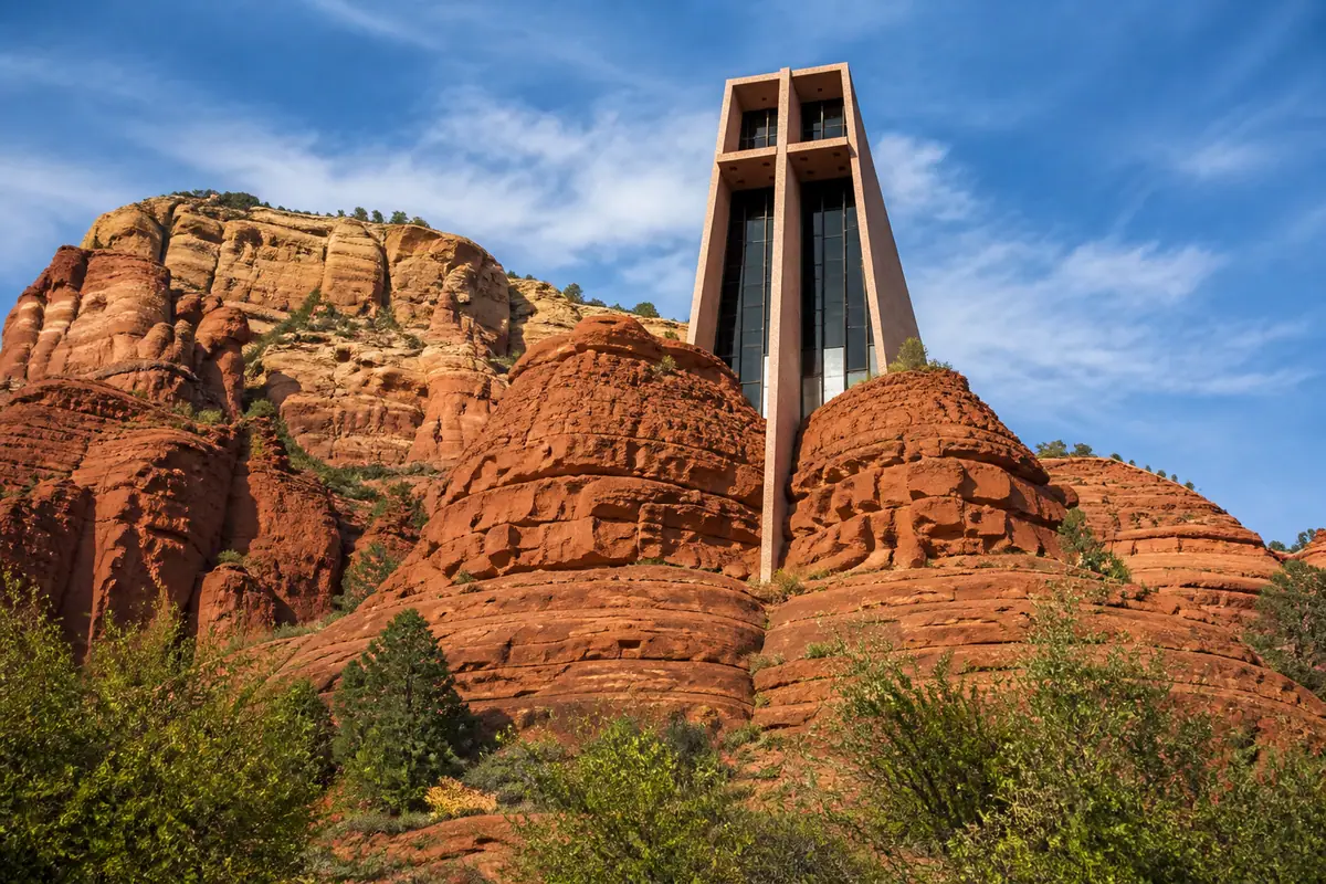 Photoreal travel-editorial view of Chapel of the Holy Cross in Sedona, Arizona