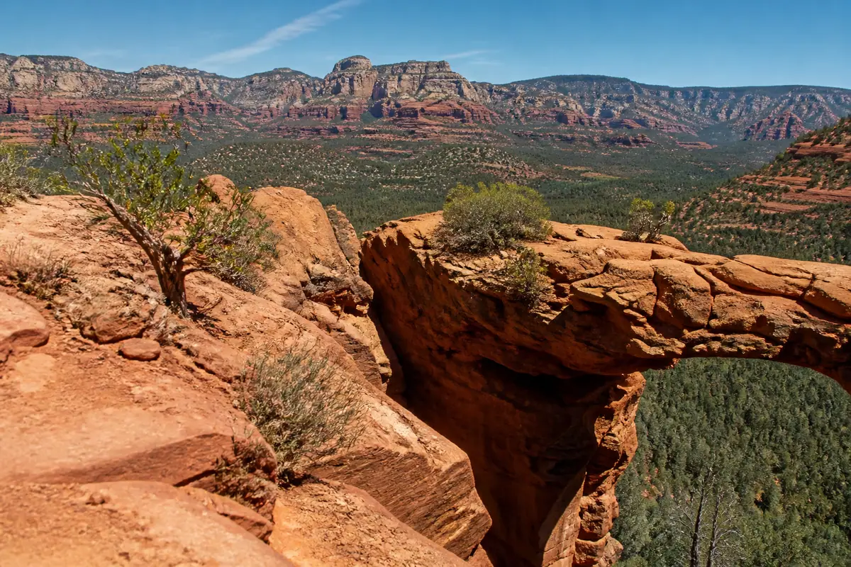 Photoreal travel-editorial view of Devil's Bridge Trail in Sedona, Arizona