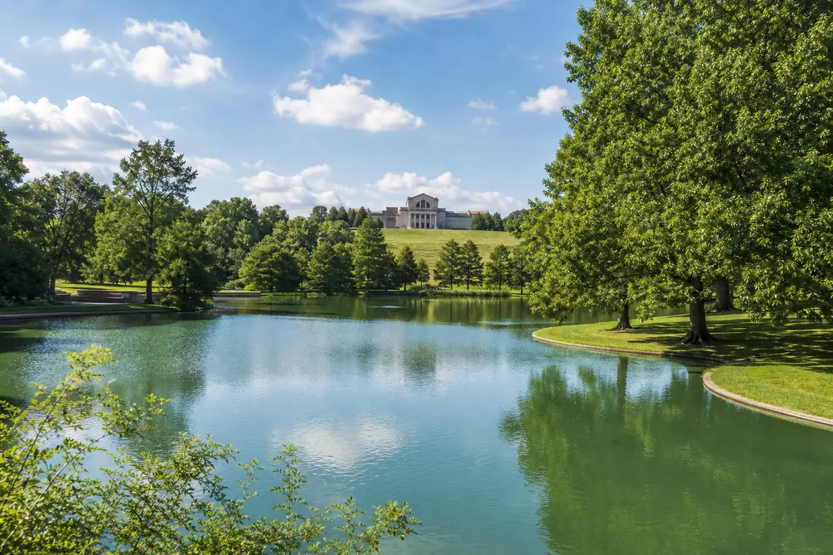 Photoreal travel-editorial view of Forest Park Walk and Grand Basin in St. Louis, Missouri