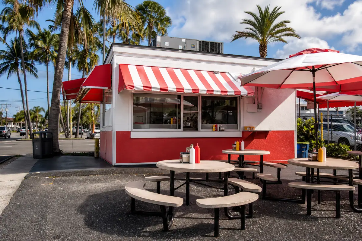 Photoreal travel-editorial dining scene representing Mel's Hot Dogs in Tampa