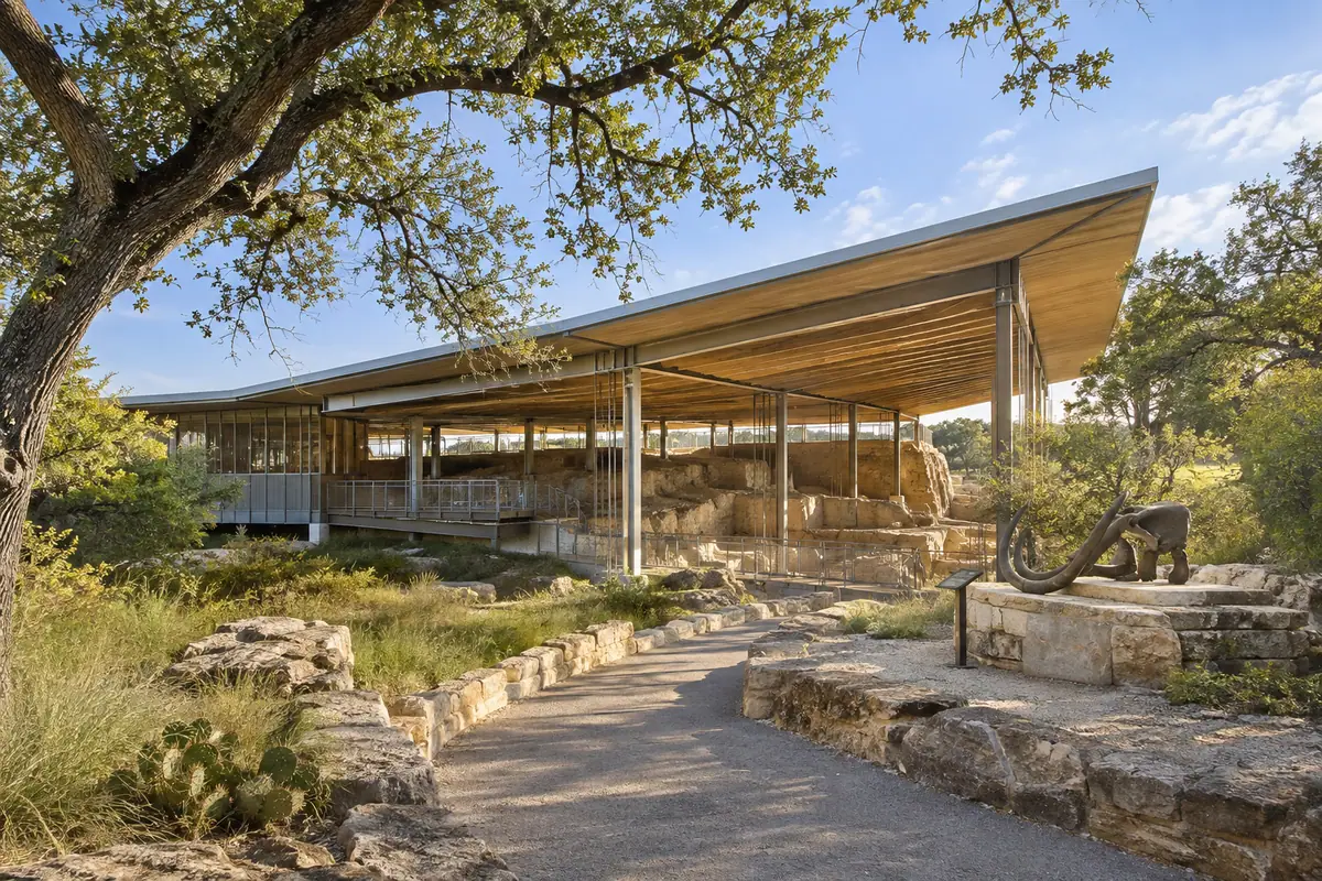 Photoreal travel-editorial view of Waco Mammoth National Monument in Waco, Texas